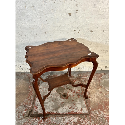 174 - A late 19th/early 20th century walnut serpentine two tier side table - approx. 73cm high x 55cm wide... 