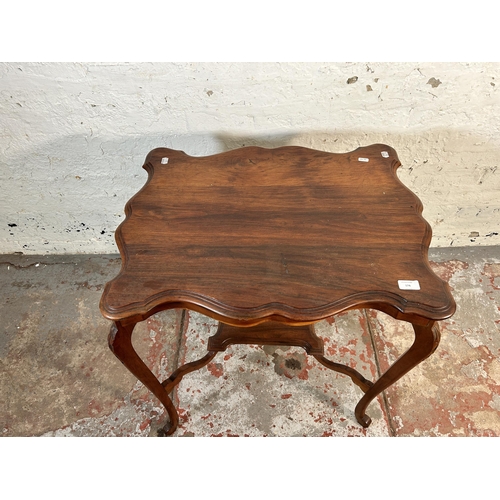 174 - A late 19th/early 20th century walnut serpentine two tier side table - approx. 73cm high x 55cm wide... 