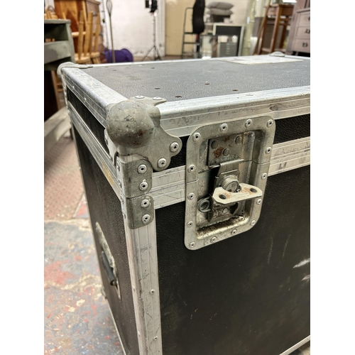 187 - A black and metal flight case on castors - approx. 78cm high x 64cm wide x 45cm deep