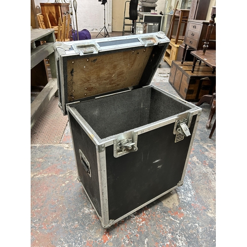 187 - A black and metal flight case on castors - approx. 78cm high x 64cm wide x 45cm deep