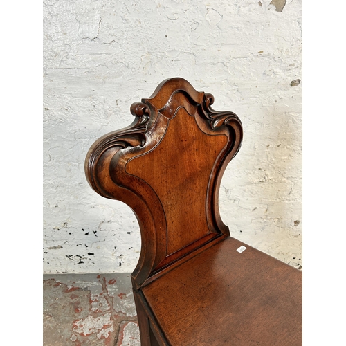 192 - A 19th century carved mahogany armorial hall chair - approx. 84cm high x 38cm wide x 37cm deep