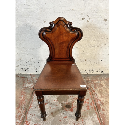 192 - A 19th century carved mahogany armorial hall chair - approx. 84cm high x 38cm wide x 37cm deep