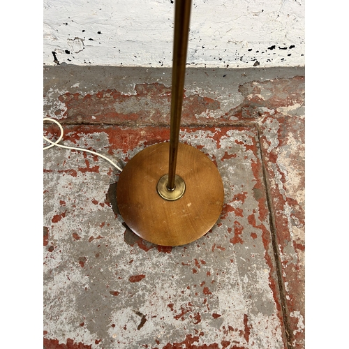 207 - A mid 20th century teak and brass standard lamp - approx. 128cm high