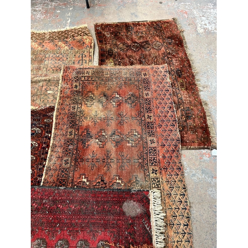 208A - A collection of Persian rugs - largest approx. 127cm x 83cm