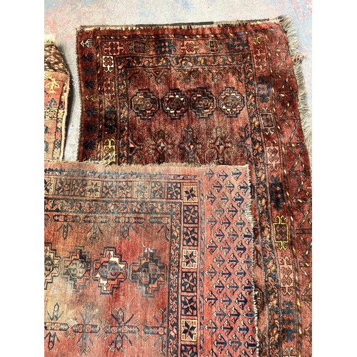 208A - A collection of Persian rugs - largest approx. 127cm x 83cm