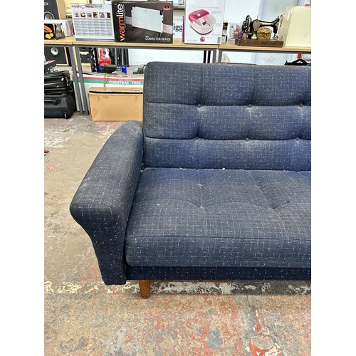 209 - A mid 20th century blue fabric upholstered three seater sofa - approx. 80cm high x 207cm wide x 81cm... 