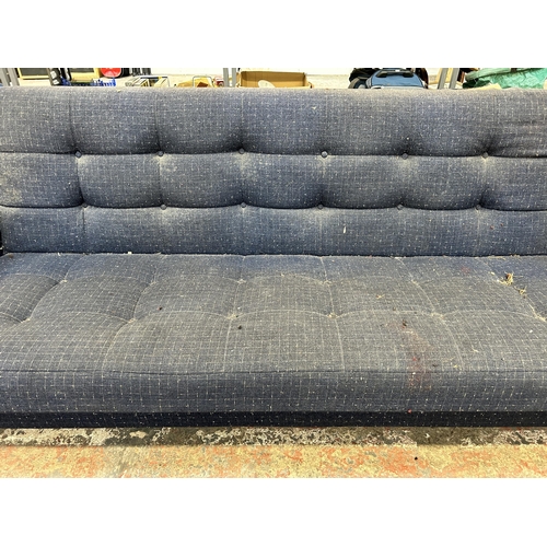 209 - A mid 20th century blue fabric upholstered three seater sofa - approx. 80cm high x 207cm wide x 81cm... 