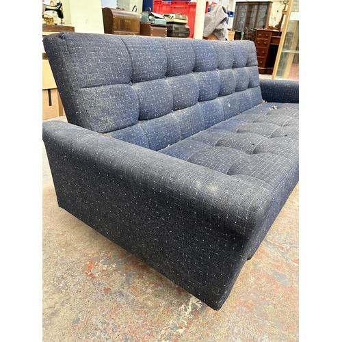 209 - A mid 20th century blue fabric upholstered three seater sofa - approx. 80cm high x 207cm wide x 81cm... 