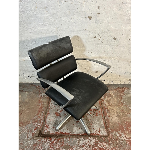 213 - A black vinyl and brushed steel height adjustable salon chair