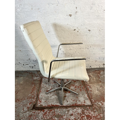 214 - A modern white leatherette and chrome plated swivel desk chair