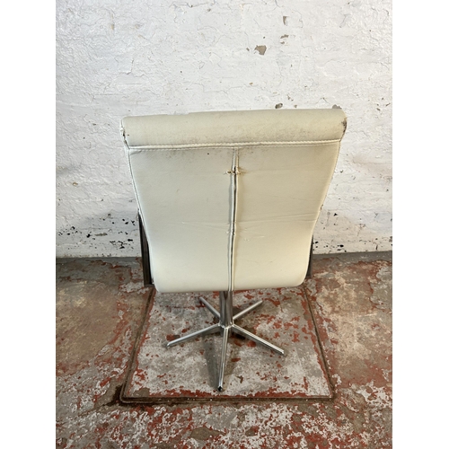 214 - A modern white leatherette and chrome plated swivel desk chair