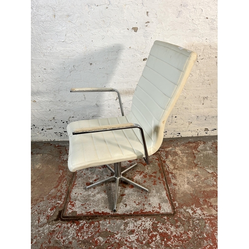 214 - A modern white leatherette and chrome plated swivel desk chair