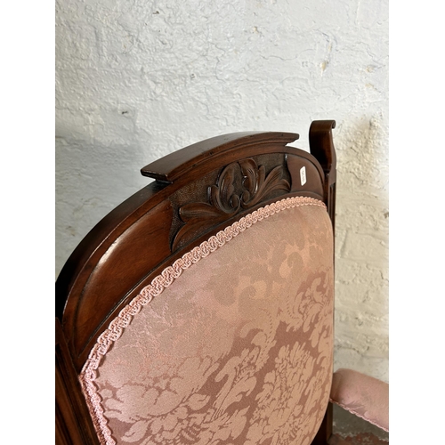 215 - An Edwardian carved walnut and pink floral fabric upholstered parlour chair - approx. 104cm high x66... 