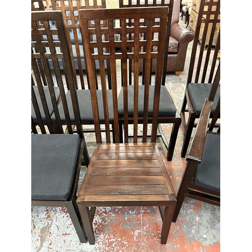 221 - Ten sheesham wood high back dining chairs with black fabric upholstered seat pads