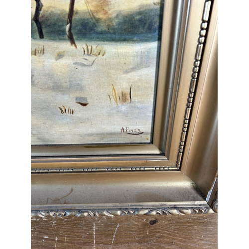 230 - An early 20th century gilt framed oil on canvas of a winter farming scene signed A.P. and dated 1923... 