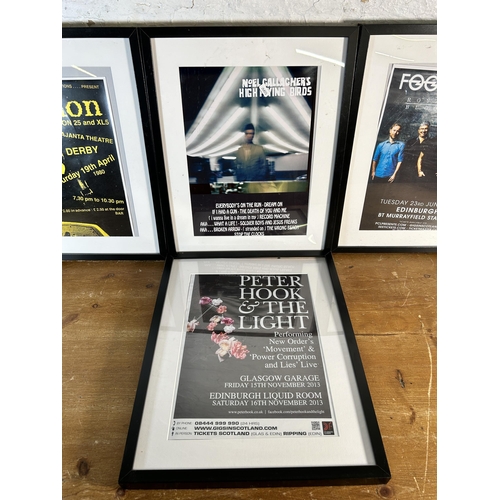 231 - Four IKEA frames containing music posters to include Joy Division, Foo Fighters etc.