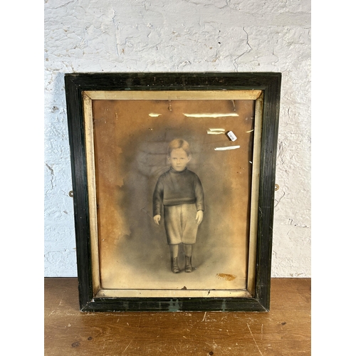 241 - An early 20th century framed charcoal portrait of a young boy - approx. 61cm high x 51cm wide