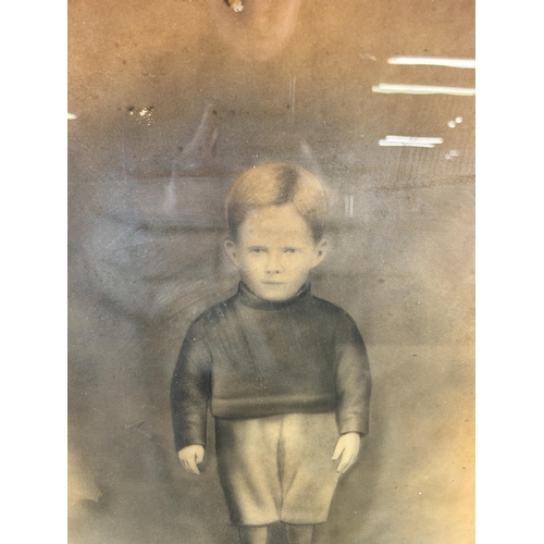 241 - An early 20th century framed charcoal portrait of a young boy - approx. 61cm high x 51cm wide