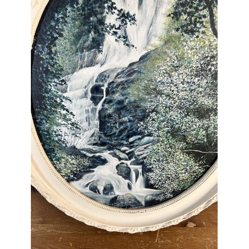 243 - A mid 20th century framed oil on board of a waterfall, signed lower right and dated 1973 - approx. 6... 