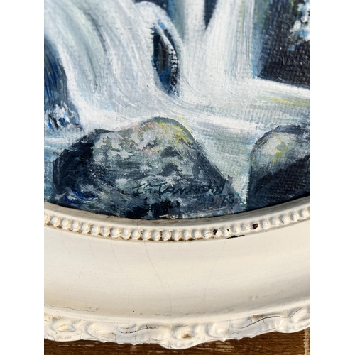 243 - A mid 20th century framed oil on board of a waterfall, signed lower right and dated 1973 - approx. 6... 