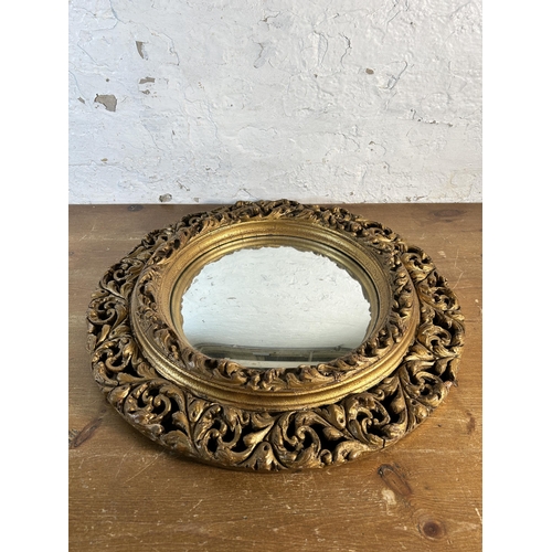 255 - A mid 20th century Atsonea gilt framed circular convex wall mirror - approx. 60cm diameter