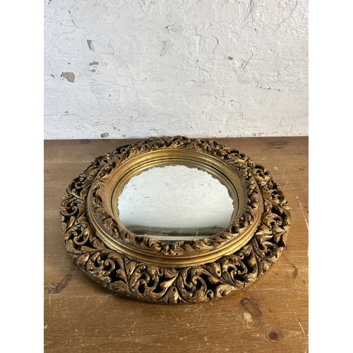 255 - A mid 20th century Atsonea gilt framed circular convex wall mirror - approx. 60cm diameter