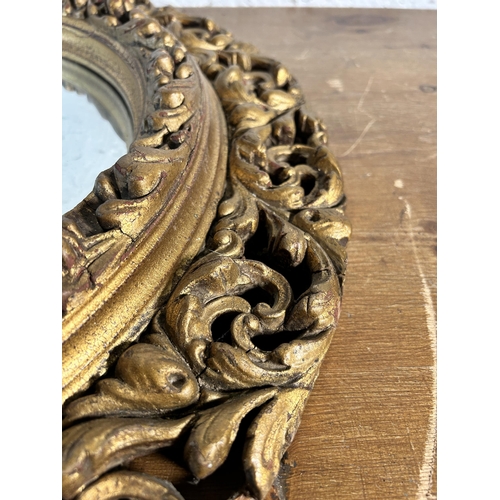 255 - A mid 20th century Atsonea gilt framed circular convex wall mirror - approx. 60cm diameter