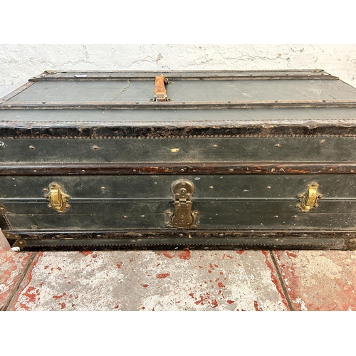 61 - An early 20th century wooden banded and blue canvas travel trunk with fitted interior, original brow... 