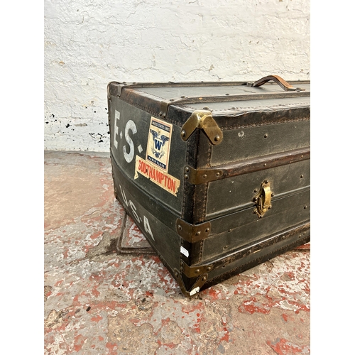 61 - An early 20th century wooden banded and blue canvas travel trunk with fitted interior, original brow... 