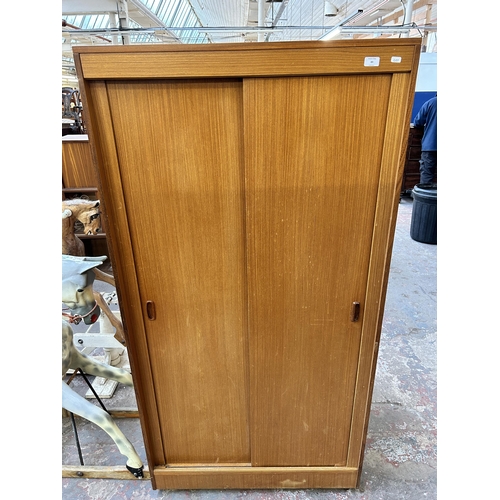 89 - A mid 20th century teak double wardrobe with fitted interior - approx. 178cm high x 92cm wide x 56cm... 