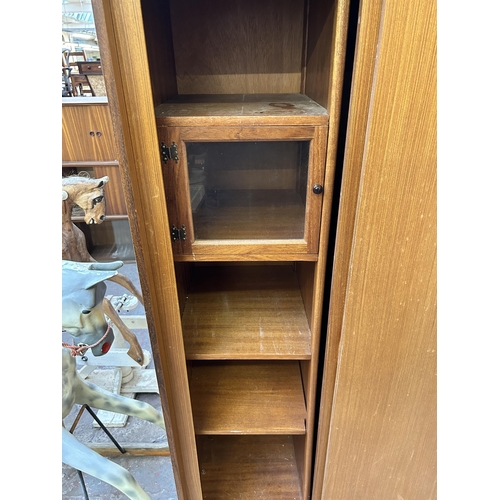 89 - A mid 20th century teak double wardrobe with fitted interior - approx. 178cm high x 92cm wide x 56cm... 