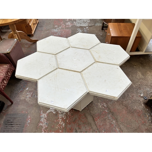 91 - A 1980s Jasp for Hexagon Designs white plastic outdoor dining table and eight stacking stools