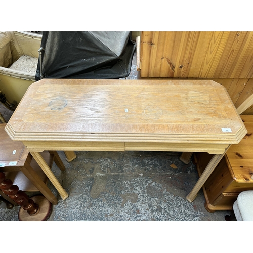 96 - A modern limed oak two drawer console table