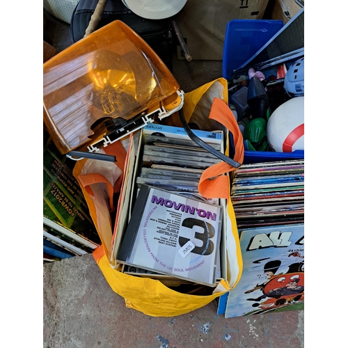 1122 - A large collection of house clearance items to include CDs, vinyl records, soft toys, vintage toys, ... 