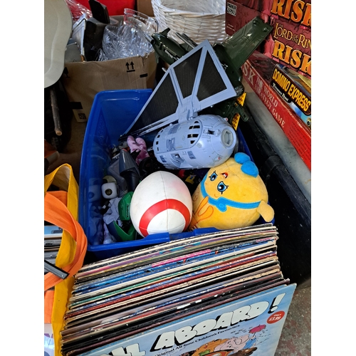 1122 - A large collection of house clearance items to include CDs, vinyl records, soft toys, vintage toys, ... 