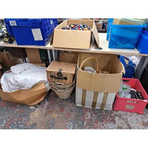 1130 - Three boxes containing wickerware, glassware, ceramics, wedding dress etc.