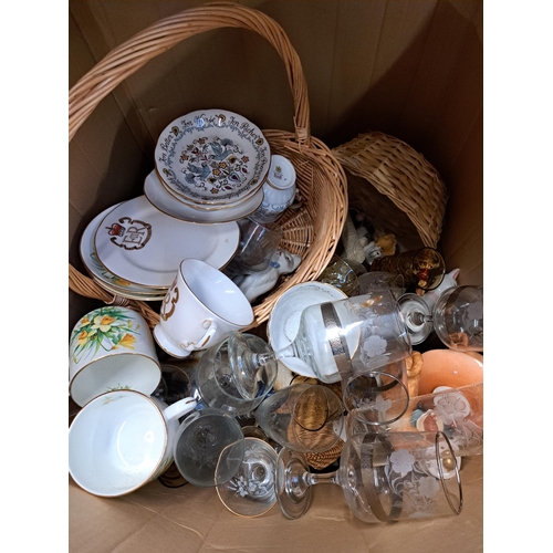 1130 - Three boxes containing wickerware, glassware, ceramics, wedding dress etc.