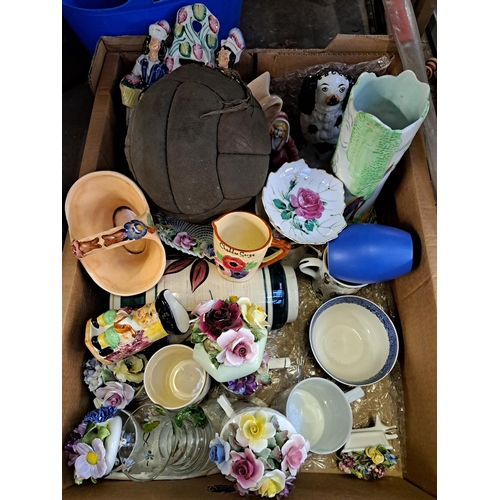 1135 - A box containing vintage football, Art Deco Radford 460 hand painted jug, Staffordshire Pottery dog,... 