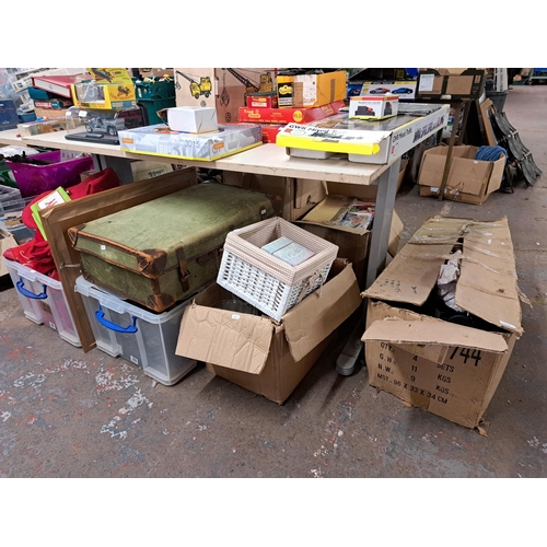 1148 - Four boxes and one vintage suitcase containing boxed Felixstowe candle holder, cut crystal glassware... 