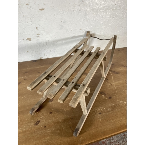 524A - A mid 20th century wooden sledge - approx. 92cm long