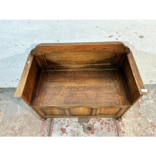 136 - A mid 20th century oak panelled storage bench - approx. 61cm high x 91cm wide x 3cm deep