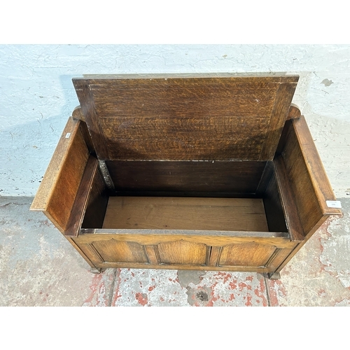 136 - A mid 20th century oak panelled storage bench - approx. 61cm high x 91cm wide x 3cm deep