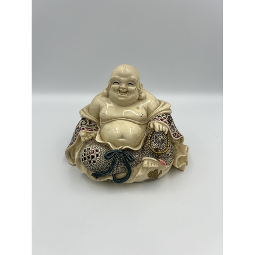 2351 - A Chinese resin buddha figurine - approx. 12cm high