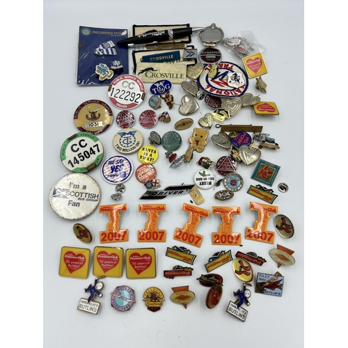 2352 - A collection of badges and buttons to include Macclesfield Town F.C., Butlins etc.