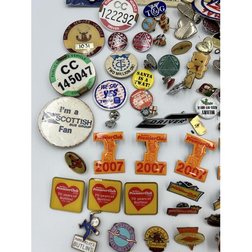 2352 - A collection of badges and buttons to include Macclesfield Town F.C., Butlins etc.