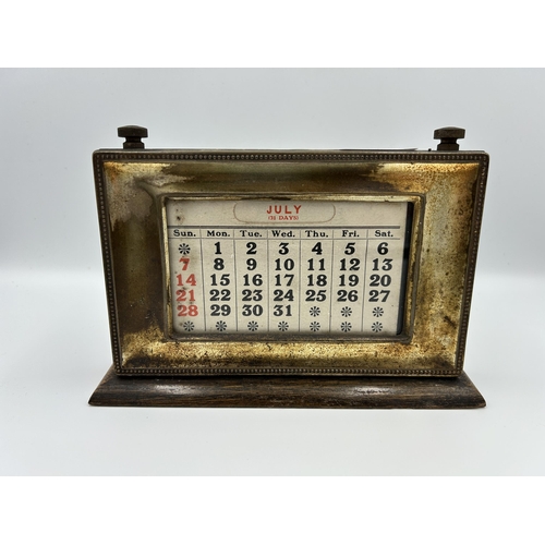 2353 - An early 20th century oak and silver plated desk calendar - approx. 14cm high x 20cm wide x 15cm dee... 