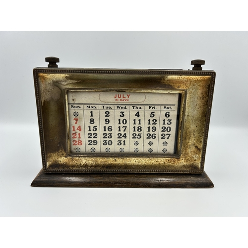 2353 - An early 20th century oak and silver plated desk calendar - approx. 14cm high x 20cm wide x 15cm dee... 