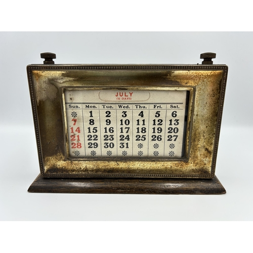 2353 - An early 20th century oak and silver plated desk calendar - approx. 14cm high x 20cm wide x 15cm dee... 