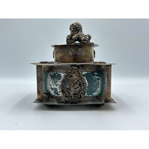 2356 - Three Oriental items, one Tibetan white metal and stone cylindrical lidded box, one Tibetan white me... 