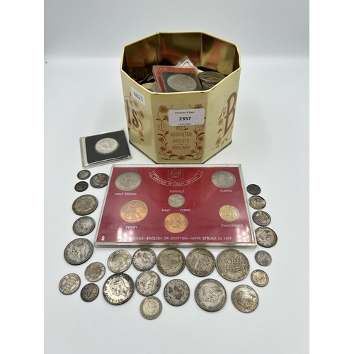 2357 - A collection of world coins with silver examples to include packaged 90% 'Kennedy' dollar, 92.5% six... 